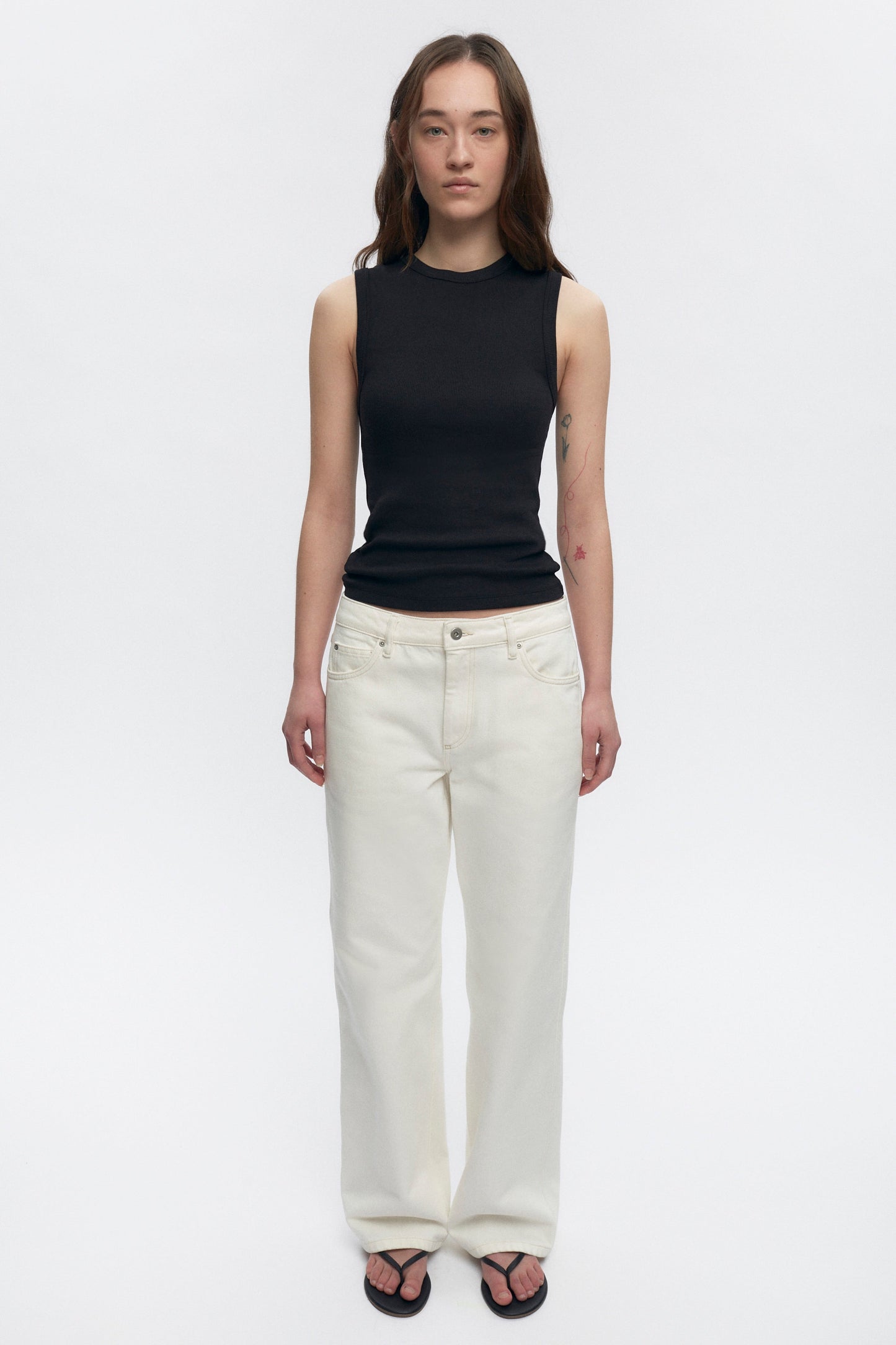 Elizabeth is 5’11" is a regular XS and is wearing an S.